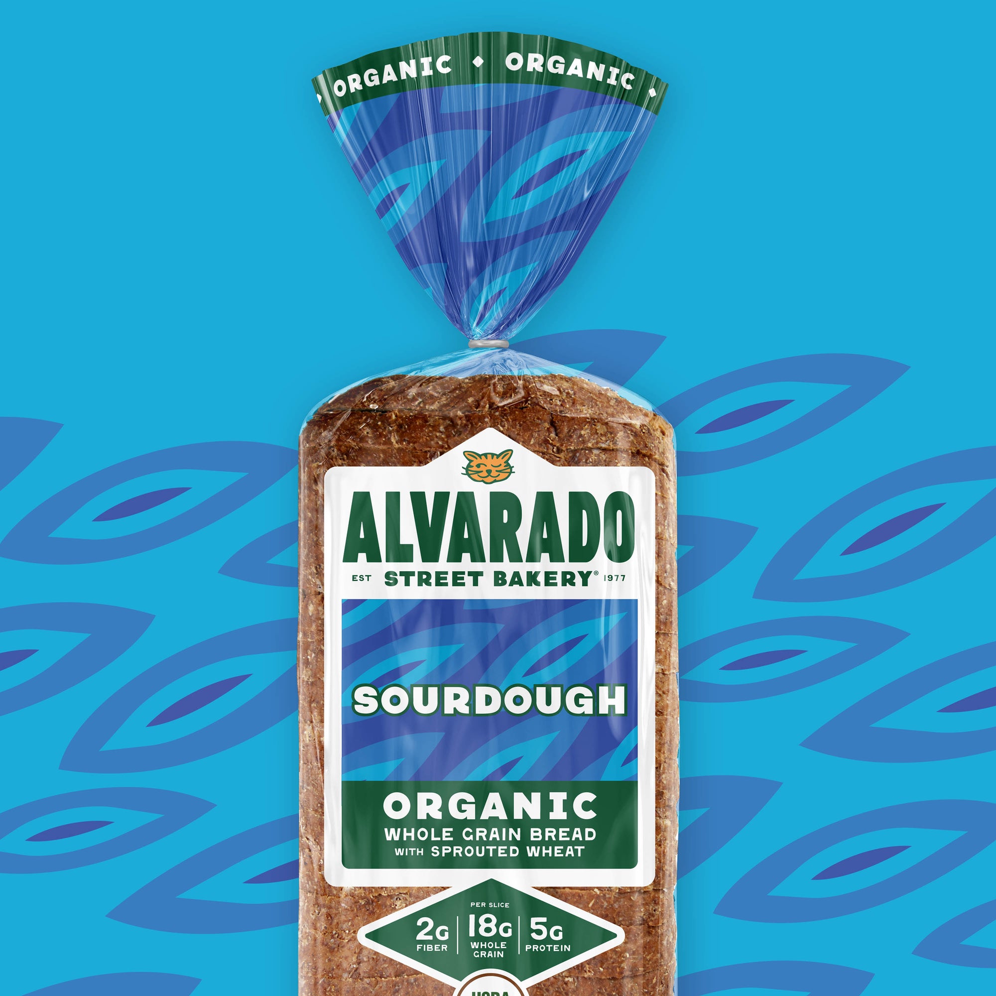 Packaged loaf of Alvarado Street Bakery sourdough organic whole grain bread on a blue background