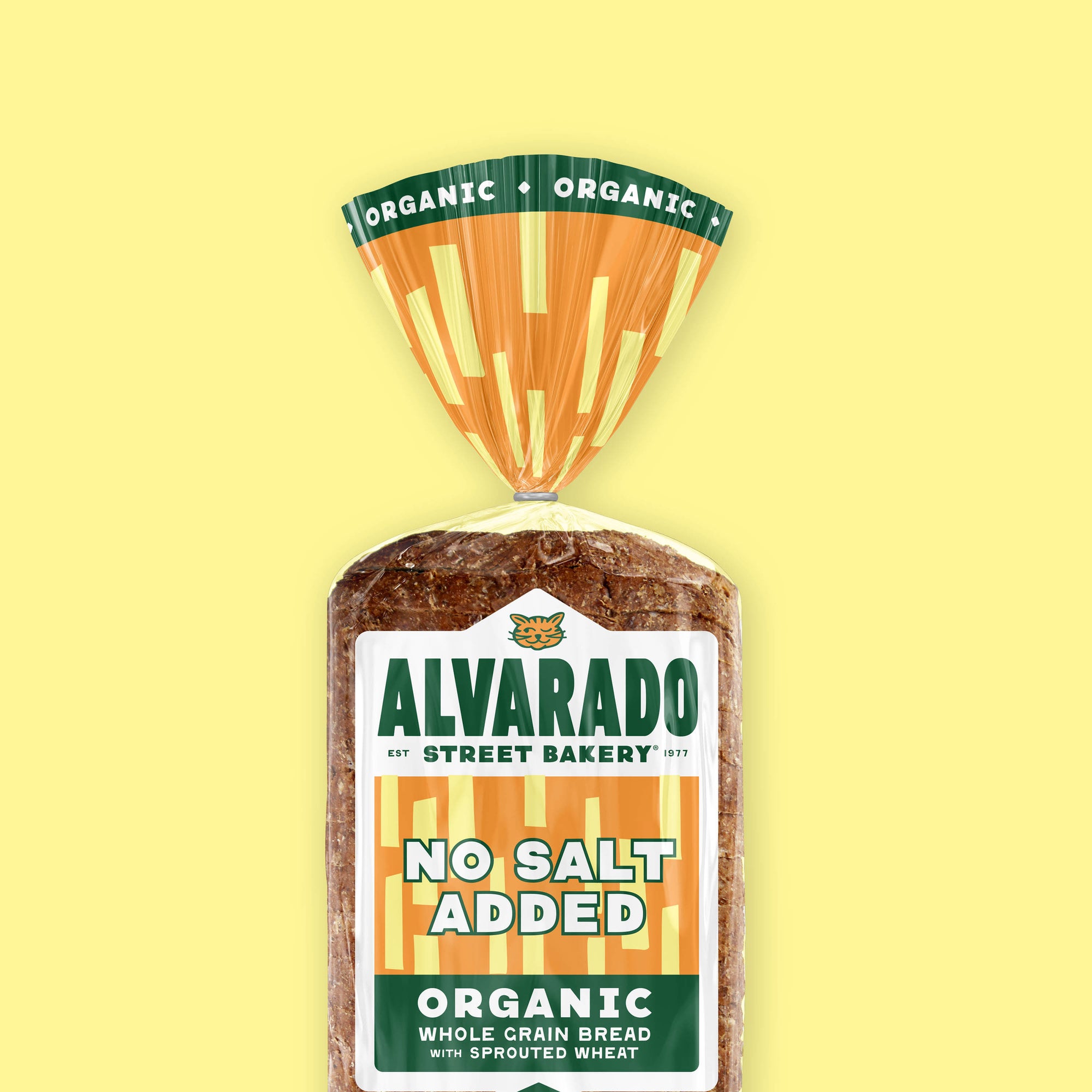 Packaged no-salt added bread with Alvarado Street Bakery label on a yellow background